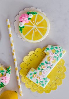 decorated cookies and lemon slices on a table