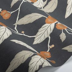 a black and orange floral wallpaper with white leaves on it's back ground