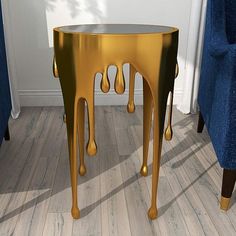 An aluminum frame sets the stage for this magnificently designed modern accent table, featuring melting legs and dripping accents all around in a glossy metallic gold finish that gives a golden honey or gilded paint-like effect. Along the metallic gold surface are natural pock marks that give it a subtle hint of texture and natural organic look. The solid black tempered glass tabletop offers a dramatic accent, holding refreshments and more. Accent Table Styling, Modern Accent Table, Modern Accent Tables, Golden Honey, Textured Design, Meeting Room, Lamps Plus, Table Style, Aluminum Frame