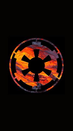 a star wars symbol painted on the side of a black background with orange and red colors