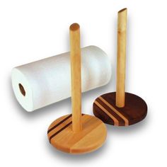 two rolls of toilet paper on wooden holders