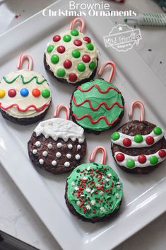 decorated christmas cookies on a white plate