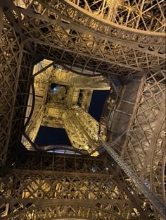 looking up at the top of the eiffel tower