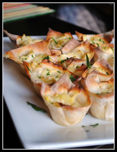 small appetizers are arranged on a white plate