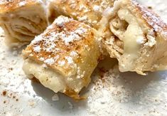 some type of pastry with powdered sugar on top