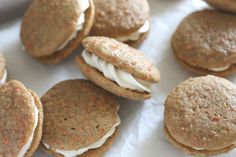 several cookies with white frosting and sprinkles