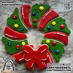 decorated christmas cookies arranged in the shape of a wreath