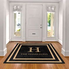 a black and gold door mat that says the brooks residence on it in front of two white doors