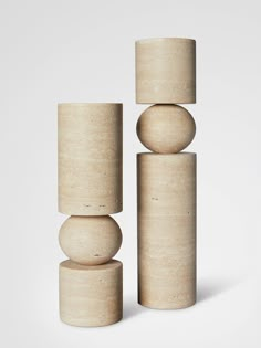 three wooden cylinders stacked on top of each other