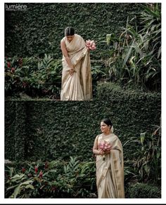 a woman standing in front of a lush green wall