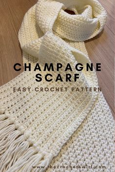 a white crochet scarf with the words champagne scarf written in black on it