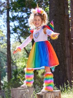 A fantastical costume that lets young imaginations soar. This colorful multi-piece set features a comfy dress with rainbow skirt, sequined heart and trim. Matching glovelets, faux fur leg warmers, fluffy rainbow tail and shimmery wings add to her delight. And for the crowning touch, a spectacular horned headband. Let the magical adventures begin! Pegasus Costume, Faux Fur Leg Warmers, Fur Leg Warmers, Costume For Girls, Kids Costumes Girls, Pegasus Unicorn, Rainbow Skirt, Bright Dress, Unicorn Costume