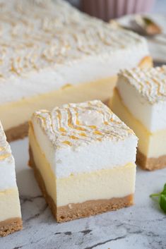 three pieces of cheesecake sitting on top of a table