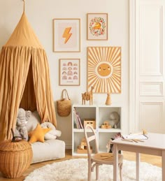 a child's playroom with toys and artwork on the wall, including a teepee tent