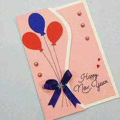 a happy new year greeting card with balloons and pearls on it's side,