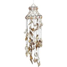 a wind chime with shells hanging from it's side and birds flying around