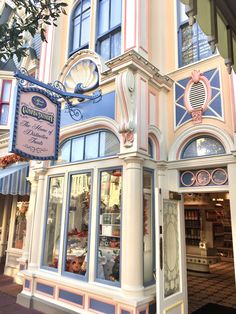 a building with a clock on the side of it's front door and windows