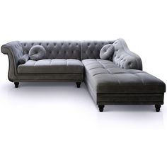 a couch with pillows on it sitting next to a footstool in front of a white background