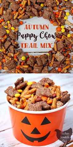 an orange bucket filled with halloween treats next to a sign that says autumn puppy chowy trail mix