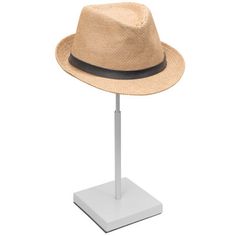 a tan hat on a white stand