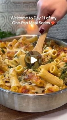 a person is cooking pasta in a pan with broccoli and cheese on the side