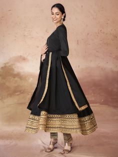 This elegant black suit features intricate embroidery and sequin work on the border, adding a touch of glamour to your look. The crepe fabric is both luxurious and comfortable, ensuring you feel confident and stylish at any occasion.
This anarkali suit set includes a fully stitched pant in a matching black color, as well as a similar color organza dupatta with designer lace work. The pants also have embroidered and sequin details, creating a cohesive and sophisticated ensemble. Available in size Anarkali Style Floor-length Set With Embroidered Border, Floor-length Anarkali Set With Embroidered Border, Festive Floor-length Churidar With Embroidered Border, Festive Floor-length Embroidered Churidar, Bollywood Style Floor-length Churidar With Embroidered Border, Floor-length Embroidered Churidar For Diwali, Bollywood Style Floor-length Embroidered Churidar, Wedding Floor-length Churidar With Embroidered Border, Chanderi Churidar With Embroidered Border In Black