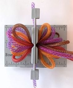 a close up of a bow on a ruler