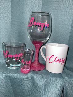 three wine glasses sitting on top of a table next to each other with the word boogie written on them