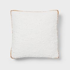 a white pillow on a gray background