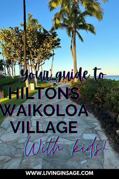 the walkway leading to hilton's waikiola village with palm trees in the background