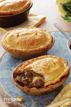 two pies sitting on top of a blue plate