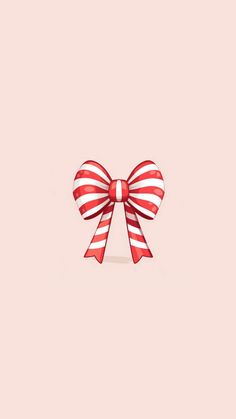 a red and white striped bow on a pink background