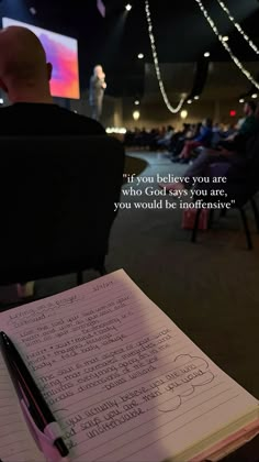 a notepad sitting on top of a chair next to a pen