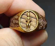 "Detail : Thai Amulet Ring, Kumarn Khai Billion, Talisman Good Luck, Fortune, Wealth, Bronze Ring, Unisex Ring, RA240404, Amulet Antique, Free Shipping Product ID : RA240404 Product Name : Amulet Bronze Ring (Random) Weight : 7 g.  Ring Size : 9.75, 10 US  Origin : Thailand  Addition : \"Kumarn Khai\" Chedi Temple (Ai Khai), Chalong Subdistrict, Sichon District, Nakhon Si Thammarat Province That is a place of faith in holiness. Many people worship and pray for good fortune, business, work, and f Spiritual Carved Gold Ring, Spiritual Gold Carved Rings, Amulet Ring, G Ring, Bronze Ring, Business Work, Unisex Ring, Good Luck, Favorite Jewelry