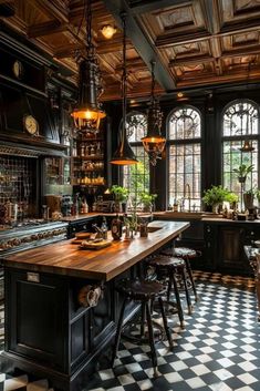 a large kitchen with black cabinets and checkered flooring on the floor is shown