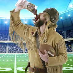 a man dressed as a football player drinking from a bottle while holding a football in his right hand