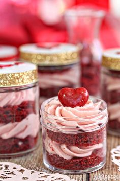 an instagram page with red velvet desserts in jars and a heart shaped strawberry on top