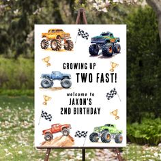 a sign that says growing up two fast welcome to jackson's 2nd birthday with monster trucks on it