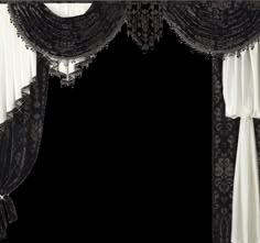 an ornate black and white curtain with tassels hanging from it's sides