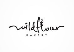 the word wildflower bakery written in cursive ink on a white paper background