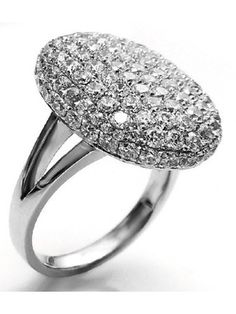 a white gold ring with diamonds on the top and bottom, set in 18k white gold