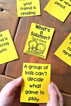 someone holding up some yellow sticky notes with words on them that say what's solution?