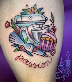 a woman's thigh with an image of a mixer and cupcakes on it