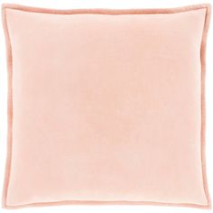 a light pink pillow on a white background