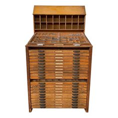 an old wooden cabinet with many drawers