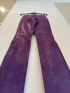 Your song plays and you NEED to hit the dance floor and you NEED to do it in these pants!! Find yourself in these purple iridescent snake skin bootcut leather pants with pockets and side zippers to give a special flare.   All measurements are taken with the garment laying flat. Vintage construction can be very different from modern garments so please be sure to as any questions about stretch of the fabric or fit before purchase. Please note that vintage size labels do not reflect modern sizing and to go by the measurements given. Condition: Excellent Guide to Condition of Vintage Clothing: Mint: Near perfect with normal wear due to age. Excellent: Slight visible wear, 1 or so minor flaws. Very Good: More noticeable wear, some noted flaws but wearable. Good: A few obvious visible flaws. Gar 80s Vintage Clothes, Purple Leather Pants, Iridescent Snake, Metallic Fashion, Vintage Construction, Purple Snake, Disco Pants, Fun Pants, Casual School Outfits