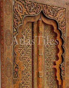 an ornate wooden door with intricate carvings on it