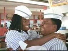 two people in chef hats hugging each other