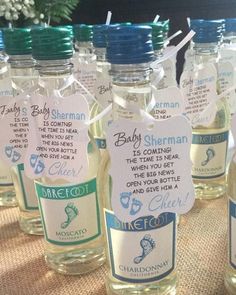 there are many bottles with labels on them for baby shower favors to be filled with water