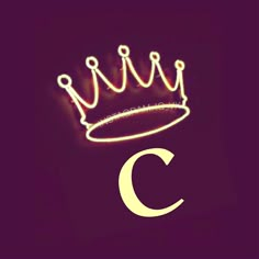 the letter c has a crown on it's head and is lit up with lights